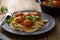 Spaghetti with eatballs tomato sauce , basil leaves in black mate plate on wooden background, delicious mediteranean food