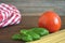 Spaghetti, fresh tomato and basil leaves