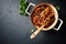 Spaghetti with fresh Tomato Sauce, Kalamata Olives and Basil in a Cooking Pan seen from above