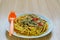 Spaghetti with minced meat and vegetables on a plate.