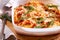 Spaghetti mozzarella bake with rocket,