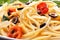 Spaghetti with olive sauce and tomatoes