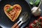 Spaghetti pasta heart love italian food diet abstract concept on black background