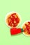 Spaghetti pasta with ketchup on green background. Minimalist. Diet, calory Italian food art concept