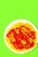 Spaghetti pasta with ketchup on green background. Minimalist. Diet, calory Italian food art concept