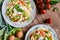 Spaghetti pasta salad with tomato, lettuce, egg, Feta cheese, green onion and sour cream