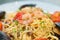 Spaghetti pasta with shrimp, mussels, tomatoes and cheese, close-up, side view. Tasty, traditional food Italians