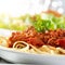 Spaghetti pasta with tomato beef sauce with lens f