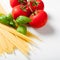 Spaghetti pasta and tomatoes with basil leaf
