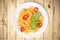 Spaghetti pasta with tomatoes on wooden background