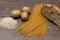 Spaghetti, rice, potatoes, and bread, on a table