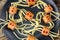 spaghetti with sausages in the form of spiders. Happy kid food for Halloween party. Top view