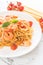 spaghetti with shrimps, tomatoes, basil and cheese