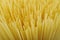 Spaghetti, yellow pasta background