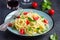 Spaghetty pasta with cherry tomatoes, basil and parmesan chees