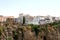 Spain. Andalucia. Ronda. White houses on the rock on blue sky background. Horizontal view.