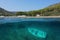 Spain coastline and small boat wreck underwater