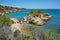 Spain Costa Dorada rocky coast with an islet