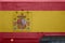 Spain flag depicted on side part of military armored truck closeup. Army forces conceptual background