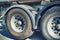 SPAIN, LLORET DE MAR - APRIL 15, 2019: wheels of a lorry traveling on the road, fragment