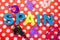 Spain made of plastic letters, castanet and costume jewelry