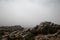 Spain, Malaga, Antequera, Torcal de Antequera: Rocks landscape with foggy background