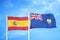 Spain and Saint Helena two flags on flagpoles and blue cloudy sky