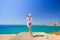 Spain, Salou. Tourist girl in blue bikini at the sea.