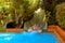 Spain, Tenerife, Adeje - December 18, 2018: Young guy slides down a waterslide in aqua park. Siam park on tenerife.