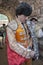 Spainish bullfighter Jose Manuel Montoliu with orange dress and silver putting itself the walk cape before initiating the