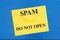 SPAM warning do not open message on white envelope on blue