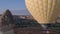 The span of a large yellow balloon, in a basket of people, close-up. Flying over the mountains - Panorama of Cappadocia