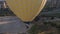 The span of a large yellow balloon, in a basket of people, close-up. Flying over the mountains - Panorama of Cappadocia