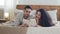 Spaniard married couple bearded husband and curly wife boyfriend and girlfriend hispanic man and woman lie on bed at