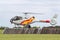 Spanish Air Force Eurocopter EC-120B Colibri helicopter from the Patrulla Aspa display team performing an aerial display.