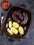 Spanish and Argentine MORCILLA blood sausages with potatoes and chile sauce