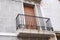 Spanish balcony with black forged openwork fencing