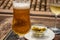 Spanish beer and glass bowl with green andalusian olives served on outdoor terrace in Granada, Andalusia, Spain