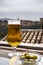 Spanish beer and glass bowl with green andalusian olives served on outdoor terrace with view on Sierra Nevada mountains in Granada