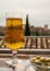 Spanish beer and glass bowl with green andalusian olives served on outdoor terrace with view on Sierra Nevada mountains in Granada