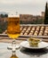 Spanish beer and glass bowl with green andalusian olives served on outdoor terrace with view on Sierra Nevada mountains in Granada