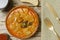 Spanish callos and golden fork and knife