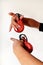 Spanish castanets in the hands on white background, close up.