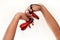 Spanish castanets in the hands on white background, close up.