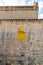 Spanish Catalonian yellow ribbon symbol for independance on the old stone wall of a cathedral