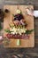 Spanish cheese and sausage board in the shape of a Christmas tree. Two people eating. Copy space