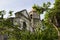 Spanish church dome in gothic style beneath green trees