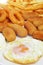 Spanish combo platter with fried eggs, croquettes, calamares and