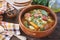 Spanish cuisine. Caldo gallego: traditional bean soup with seasonal vegetables and sausages