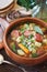 Spanish cuisine. Caldo gallego: traditional bean soup with seasonal vegetables and sausages